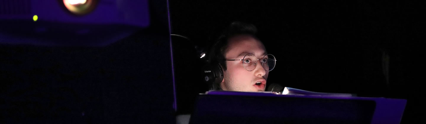 Image of stage manager behind the scenes